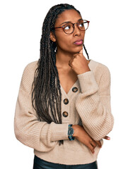 African american woman wearing casual clothes with hand on chin thinking about question, pensive...