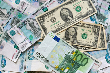 background of paper bills dollars, euros and rubles. Currency exchange rate