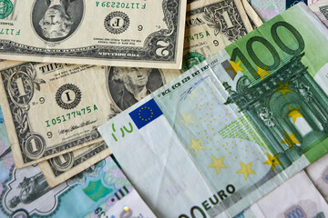 background of paper bills dollars, euros and rubles. Currency exchange rate