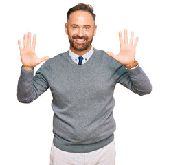 Handsome middle age man wearing business clothes showing and pointing up with fingers number ten while smiling confident and happy.