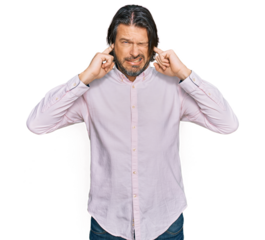 Middle age handsome man wearing business shirt covering ears with fingers with annoyed expression for the noise of loud music. deaf concept.