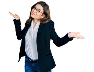 Young caucasian girl wearing business style and glasses clueless and confused expression with arms and hands raised. doubt concept.