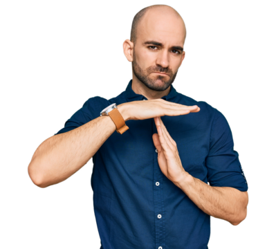 Young hispanic man wearing casual clothes doing time out gesture with hands, frustrated and serious face