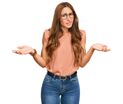 Young hispanic woman wearing casual clothes and glasses clueless and confused with open arms, no idea concept.