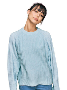 Young hispanic woman wearing casual clothes looking sleepy and tired, exhausted for fatigue and hangover, lazy eyes in the morning.