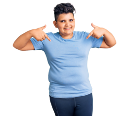 Little boy kid wearing sports workout clothes looking confident with smile on face, pointing oneself with fingers proud and happy.