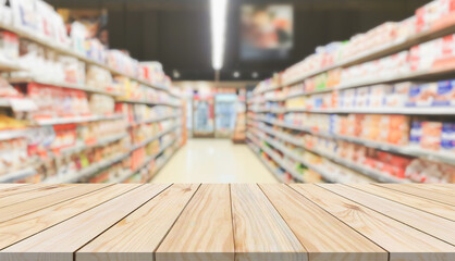 Empty wood table top with supermarket blurred background for product display