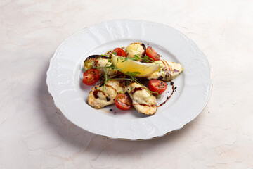 Cooked mussels with cheese in a plate.