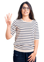 Brunette teenager girl wearing casual clothes and glasses showing and pointing up with fingers number four while smiling confident and happy.