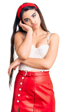 Brunette teenager girl wearing elegant look thinking looking tired and bored with depression problems with crossed arms.