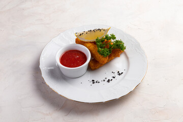 Fried cheese sticks in a bowl. On a light background.