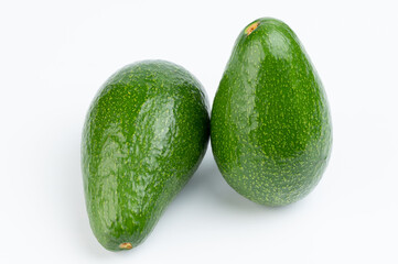 Two green avocado fruits