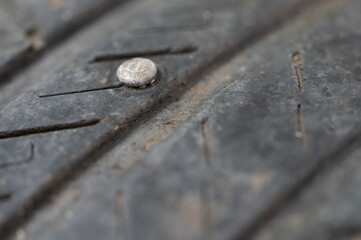 Rusty nail in flat tyre