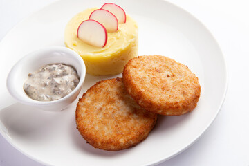 Cutlets and mashed potatoes in a plate.