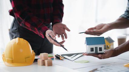 Creative Engineer and Architect Meeting for Collaborative Design and Project Planning in the Workplace.