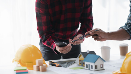 Creative Engineer and Architect Meeting for Collaborative Design and Project Planning in the Workplace.