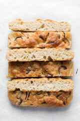 Top view of homemade onion focaccia on a white background, Flatlay of focaccia with red onion topping, fresh homemade focaccia bread