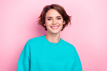 Photo of charming cheery girl white teeth smile wear turquoise oversize jumper isolated pink color background