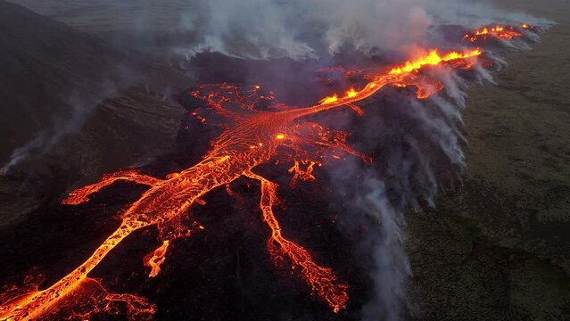 Volcano eruption in 2023, Red burning lava erupts from the ground in Iceland. Formation of a new active volcano. Aerial footage.