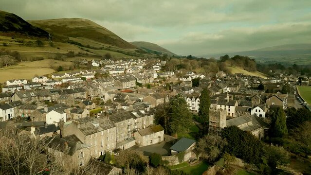 Behold the dramatic allure of the rural Cumbrian countryside through captivating drone footage, capturing the small English town of Sedbergh on the edge of the Yorkshire Dales