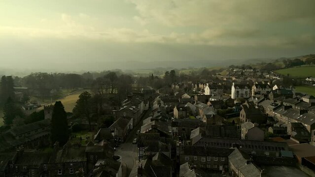 Behold the dramatic allure of the rural Cumbrian countryside through captivating drone footage, capturing the small English town of Sedbergh on the edge of the Yorkshire Dales