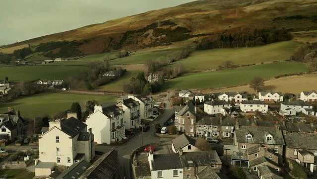 Behold the dramatic allure of the rural Cumbrian countryside through captivating drone footage, capturing the small English town of Sedbergh on the edge of the Yorkshire Dales