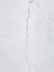 Cracked broken wall at the outside building cement