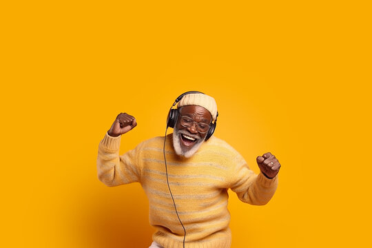 Photo of crazy old man listening to music dancing wearing headphones