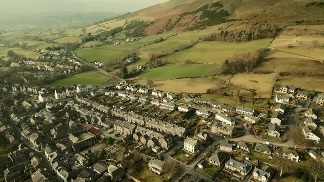 Behold the dramatic allure of the rural Cumbrian countryside through captivating drone footage, capturing the small English town of Sedbergh on the edge of the Yorkshire Dales