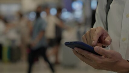 Business man using mobile phone to book plane ticket through online application, sitting on travel checking travel time on board at airport, travel, payment, due, booking, online, check in