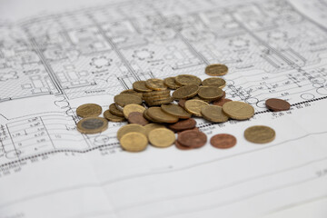 Coins, house key wallet and house drawing on the table. Crime for rent payment. Make money by business idea concept image close up. Concept image of buying a house