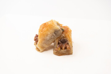 Delicious sweet baklava with walnuts isolated on white background.