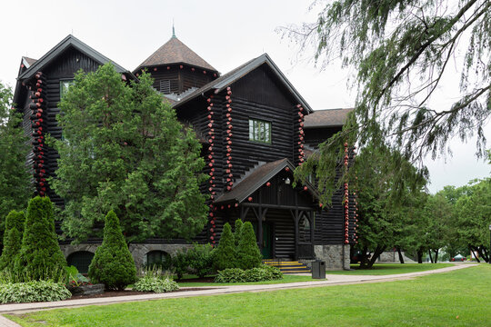 Montebello, Quebec, Canada, July 12, 2023 - Side entrance of the 1930 Fairmont&nbsp;Le&nbsp;Ch&acirc;teau Montebello&nbsp;hotel seen during a summer day from its grounds