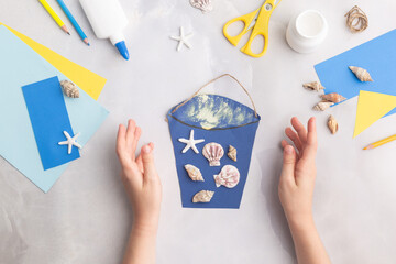 Paper bucket of shells summer idea for kids craft in kindergarten hands ocean's day