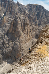 Dolomites, Italy - climbers in the trail, Sassolungo and Sassopiatto, Selva di Val Gardena