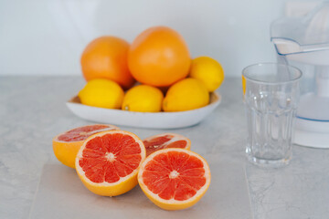 Juice extractor or juicer preparing to make grapefruit juice