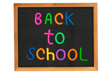 Back to school written on a framed blackboard, isolated background. Top view flat lay concept. Childish lettering, multicolored letters for primary school, elementary school or grade school,