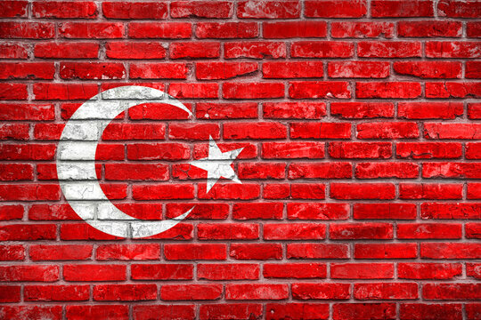 National Turkish flag is depicted on a grunge brick wall