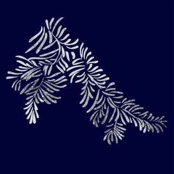 Christmas tree branch with silver grey foil texture isolated on dark blue background.