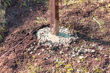 Fototapeta premium Pillar filled with concrete in the ground