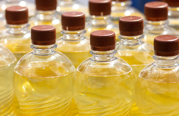 Bottles of sunflower oil on a light background. Selective focus