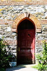 Old wooden red door. Medieval door.