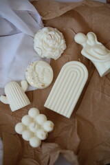 different shapes  wax candle  on wood stand