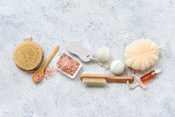 Fototapeta na wymiar Composition with bath accessories and cosmetic products on light background