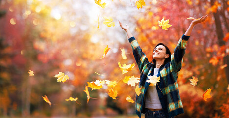 Happy woman enjoying life in the autumn - 623217538