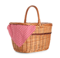 Fototapeta na wymiar Wicker picnic basket with napkin isolated on white background