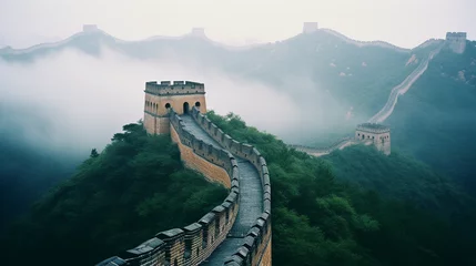 Fotobehang Moody, atmospheric shot of the Great Wall of China disappearing into a misty mountain range, muted earth tones, sense of infinite distance © Marco Attano