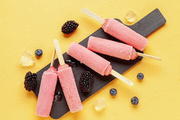Fruit vegan ice pop and berries on table. Top view