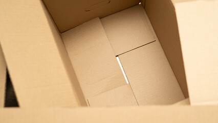 open cardboard boxes close-up, cutout for handle in cardboard box