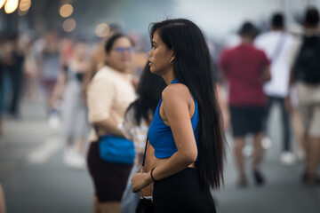 girl in profile on a busy street